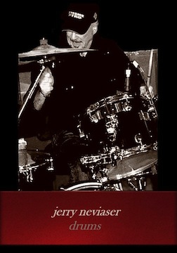 Photo of Jerry Neviaser on drums performing onstage.